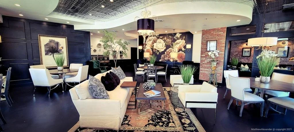 Elegant hospitality lobby with ivory seating against espresso paneling