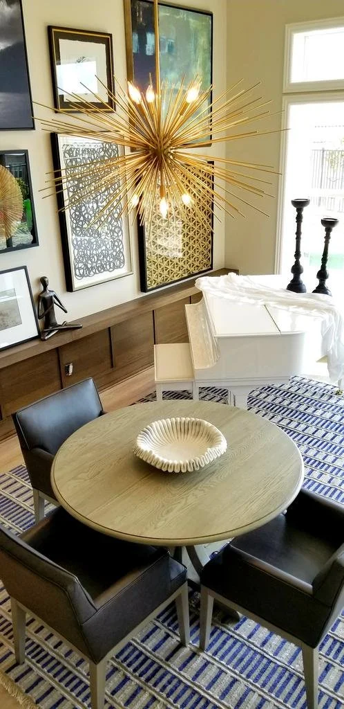 Living and dining room with sputnik chandelier and gallery wall, interior design by Matthew Alexander Creations