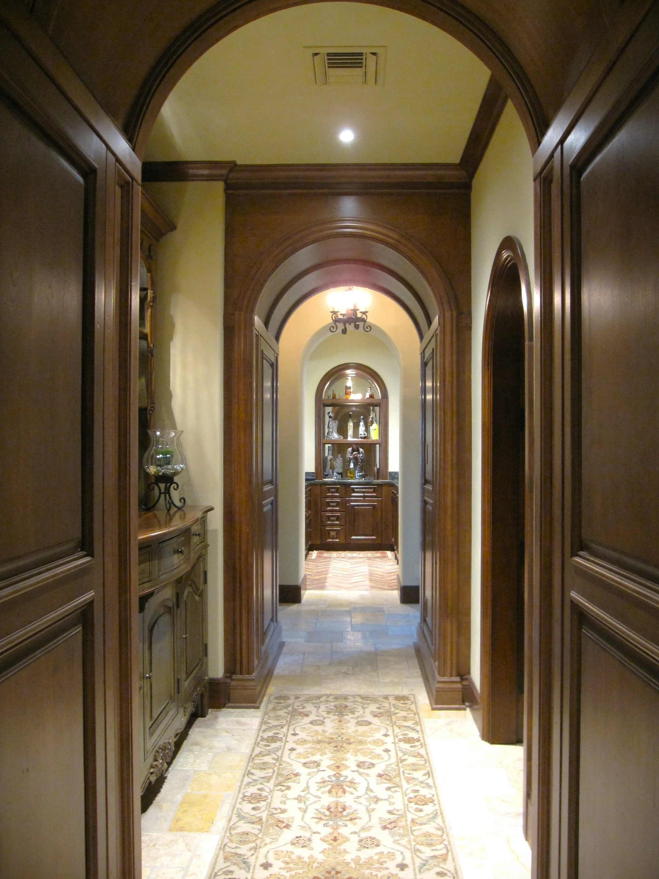 Arched wood passageway showing architectural space planning and detailing